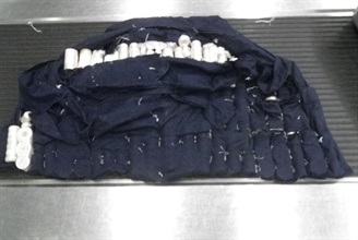 The tailor-made vest concealing the suspected worked ivory.