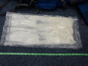 Suspected cocaine found inside the false compartment of the rucksack.