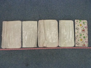 Five slabs of cotton pads soaked with suspected cocaine.