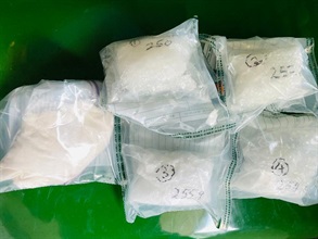 Hong Kong Customs conducted a series of anti-narcotics operations between June 5 and today (June 8) and detected four dangerous drugs trafficking cases. A batch of suspected dangerous drugs worth about $17.3 million in total was seized in various districts and Hong Kong International Airport (HKIA), including about 41 kilograms of suspected cannabis buds, about 5kg of suspected cocaine, about 1.75kg of suspected ketamine, about 1.3kg of suspected cannabis resin and about 1kg of suspected methamphetamine. Nine men and two women, aged between 15 and 49, were arrested during the operations. Photo shows some of the suspected ketamine and suspected methamphetamine seized at HKIA and Tai Wo Hau.