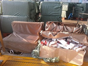 Some of the suspected illicit cigarettes found inside sofas.