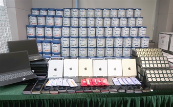 Hong Kong Customs and Macao Customs mounted a joint enforcement operation in June this year to vigorously combat sea smuggling activities through intelligence exchanges between the two places. During the operation, the two Customs administrations seized smuggled goods, including expensive food ingredients, red wine, electronic products and cash, with a total estimated market value of over $110 million. Photo shows some of the suspected smuggled powdered formula and electronic products seized by Hong Kong Customs.