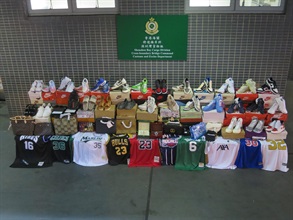 Hong Kong Customs on July 11 seized a batch of suspected controlled items, including about 44.2 kilograms of suspected synthetic cathinone (bath salts), about 1 300 suspected prohibited weapons and about 10 000 suspected alternative smoking products, as well as about 580 items of suspected counterfeit goods, at Shenzhen Bay Control Point. The total estimated market value was about $6.3 million. Photo shows the suspected counterfeit goods seized.