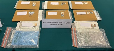 ​​Hong Kong Customs stepped up enforcement at Hong Kong International Airport from January to June this year to combat the smuggling of dangerous drugs through air cargo and air passenger channels. A total of 332 dangerous drug cases were detected and about 1.16 tonnes of suspected dangerous drugs with an estimated market value of nearly $600 million were seized. Photo shows some of the seized suspected ecstasy, which was concealed inside some envelopes.