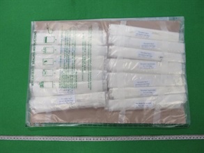 Hong Kong Customs detected three drug trafficking cases through the air cargo channel between November last year and June this year. A total of about 11 kilograms of suspected cocaine and about 685 grams of suspected heroin with an estimated market value of about $16.2 million were seized at Tsing Yi and Hong Kong International Airport. A man suspected to be connected with the cases was arrested yesterday (June 3). Photo shows some of the suspected heroin seized.