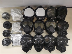 Hong Kong Customs and the Police today (June 3) conducted a joint operation to combat the illegal import of strategic commodities. A batch of strategic commodities, including 14 gas masks and eight filter canisters, suspected to be imported without a valid licence was seized in Tai Po and Tai Wai. Two persons were arrested. Photo shows the gas masks and filter canisters seized in Tai Po.