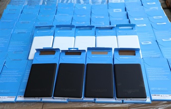 Hong Kong Customs on August 16 detected a suspected smuggling case involving a river trade vessel in the western waters of Hong Kong. A large batch of suspected smuggled goods with a total estimated market value of about $43 million was seized, including assorted electronic products, cosmetic products and high-value food. Photo shows some suspected smuggled e-book readers seized.