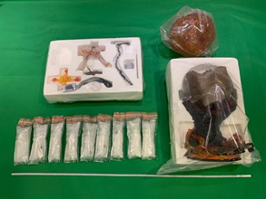 Hong Kong Customs on August 9 and 15 and yesterday (September 7) seized about 12 kilograms of suspected methamphetamine and about 570 grams of suspected heroin, with an estimated market value of about $6.9 million and about $680,000 respectively, in Hong Kong International Airport, Tuen Mun, Kwai Chung, Mong Kok and San Po Kong. Photo shows the suspected methamphetamine seized by Customs officers in Kwai Chung and the figure used to conceal the drugs.