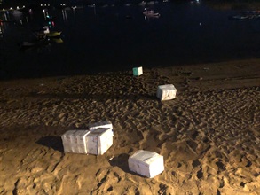 Hong Kong Customs and the Marine Police detected a suspected speedboat smuggling case in Sai Kung during a joint operation yesterday (September 10). About 400 kilograms of suspected smuggled high-end frozen Wagyu beef with an estimated value of around $2 million were seized. Picture shows foam boxes carrying suspected smuggled frozen Wagyu beef left abandoned along the seashore by suspected smugglers when they were escaping.