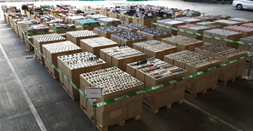 Hong Kong Customs conducted a two-week enforcement operation codenamed "Tracer III" from September 28 to October 11 to combat counterfeit goods activities involving cross-boundary transhipments and local deliveries. During the operation, Customs detected 14 related cases and seized more than 63 000 items of suspected counterfeit goods, including watches, mobile phone accessories, sunglasses, football jerseys, handbags and footwear, with an estimated market value of over $30 million. Photo shows some of the suspected counterfeit goods seized.