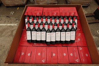 Hong Kong Customs on October 26 detected a suspected case of using an ocean-going vessel to smuggle goods to the Mainland at the Kwai Chung Container Terminals. A large batch of suspected smuggled goods, including expensive food ingredients, table wines, electronic goods, solid waste and scheduled endangered species, with a total estimated market value of about $300 million was seized. This is the largest sea smuggling case detected by Customs this year in terms of the seizure value. Photo shows some of the suspected smuggled red wine seized.