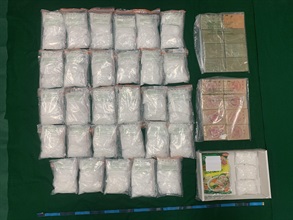 Hong Kong Customs seized about 19 kilograms of suspected methamphetamine and about 6kg of suspected heroin, with a total estimated market value of about $16 million, at Kwai Chung Customhouse on November 16. Photo shows the suspected methamphetamine and suspected heroin seized, and one of the packaging bags of seasoning powders used to conceal the drugs.