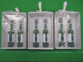 Hong Kong Customs seized about 5 kilograms of suspected liquid cocaine and about 3.2 kilograms of suspected liquid ketamine with a total estimated market value of about $9.7 million at Hong Kong International Airport respectively on December 29 last year and February 3 this year. Photo shows the wine bottles used to conceal the suspected liquid cocaine.