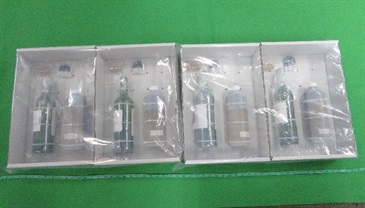 Hong Kong Customs seized about 5 kilograms of suspected liquid cocaine and about 3.2 kilograms of suspected liquid ketamine with a total estimated market value of about $9.7 million at Hong Kong International Airport respectively on December 29 last year and February 3 this year. Photo shows the suspected liquid ketamine seized and the wine bottles used to conceal the dangerous drugs.