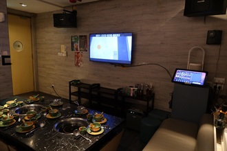 Hong Kong Customs yesterday (December 15) conducted an enforcement operation codenamed "Magpie" throughout the city to combat illegal activities involving party room and restaurant operators providing infringing karaoke songs to customers in the course of business. Photo shows a restaurant in Tsim Sha Tsui raided by Customs officers.