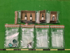 Hong Kong Customs seized four bottles of cannabidiol (CBD) oil and about four grams of suspected cannabis buds with an estimated market value of about $5,000 at Hong Kong International Airport, Yau Ma Tei and Tseung Kwan O on February 6 and today (February 8). Photo shows the suspected CBD oil, suspected cannabis buds and grinder seized by Customs officers.