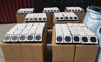 Hong Kong Customs on February 21 detected a suspected case of using an ocean-going vessel to smuggle goods to Malaysia at the Kwai Chung Container Terminals. A large batch of suspected smuggled goods, including electronic waste, vehicle parts and TV set-top boxes, with a total estimated market value of about $12 million was seized. Photo shows some of the suspected smuggled TV set-top boxes seized.