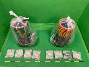 Hong Kong Customs yesterday (March 4) seized about 2 kilograms of suspected methamphetamine with an estimated market value of about $1.1 million at Hong Kong International Airport. Photo shows the suspected methamphetamine seized and the djembes used to conceal the drugs.