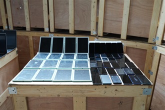 Hong Kong Customs on March 27 detected a suspected smuggling case involving an outgoing container truck at the Man Kam To Control Point and seized about 510 000 suspected smuggled electronic products and electronic parts with a total estimated market value of about $30 million. Photo shows some of the suspected smuggled mobile phones and computer tablets seized.