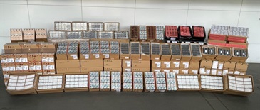 Hong Kong Customs yesterday (April 13) mounted an anti-smuggling operation at the Lok Ma Chau Control Point and detected a suspected smuggling case involving a cross-boundary container truck. About 200 000 suspected smuggled mobile phone parts, including circuit boards, display screens and camera lens, with an estimated market value of about $6 million were seized. Photo shows the suspected smuggled goods seized.