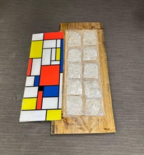 Hong Kong Customs detected two dangerous drugs cases in Yuen Long and Tuen Mun on June 16 and yesterday (June 20) respectively and seized about 32 kilograms of suspected ketamine and about 3.5kg of suspected cannabis buds. The total estimated market value was about $14.7 million. Photo shows some of the suspected ketamine seized by Customs officers in the first case and a wooden table used to conceal the drugs.