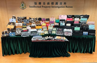 Hong Kong Customs conducted an enforcement operation today (June 23) and detected a case of selling suspected counterfeit goods through live webcasts on social media platform. Preliminary figures show that about 1 000 items of suspected goods, including leather goods, clothes and accessories, with an estimated market value of about $1 million were involved in the case. Photo shows some of the suspected counterfeit goods seized.