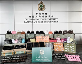 Hong Kong Customs on April 1 detected a counterfeit goods smuggling case at the Kwai Chung Customhouse Cargo Examination Compound and seized about 21 000 items of goods suspected to be involved in the case, with an estimated market value of about $2 million. Photo shows some of the suspected counterfeit and smuggled goods seized.