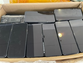 Hong Kong Customs yesterday (June 28) mounted an anti-smuggling operation at Yau Tong industrial area and detected a suspected speedboat smuggling case. A batch of suspected smuggled goods, including red coral, dried fish maws, bird nests, dried shark fins and used mobile phones, with an estimated market value of about $14 million was seized. Photo shows some of the suspected smuggled used mobile phones seized.