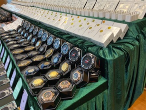 Hong Kong Customs conducted a three-week special enforcement operation from June 13 to yesterday (July 3) to combat counterfeit electronic goods activities involving cross-boundary transshipments and local deliveries. During the operation, Customs detected a total of 17 related cases and seized more than 26 000 items of suspected counterfeit electronic goods with an estimated market value of over $6.8 million. Photo shows some of the suspected counterfeit earphones, electronic watches and mobile phone accessories seized.