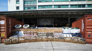 Hong Kong Customs mounted a special operation codenamed "Wave Breaker" from August to September and detected four suspected smuggling cases involving ocean-going vessels and two suspected smuggling cases involving river trade vessels. A large batch of suspected smuggled goods, including over 500 000 electronic products, about 2 000 bottles of table wines, about 240 pallets of electronic wastes, about seven tonnes of suspected scheduled shark fins, and about three tonnes of frozen meat, with a total estimated market value of about $100 million was seized. Photo shows some of the suspected smuggled goods seized.