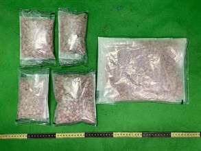 Hong Kong Customs detected two drug trafficking cases involving baggage concealment yesterday (October 5) at Hong Kong International Airport. About 2.1 kilograms of suspected heroin and about 2.1kg of suspected ecstasy, with a total estimated market value of about $2.1 million, were seized. Photo shows the suspected ecstasy seized.