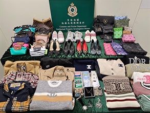 Hong Kong Customs yesterday (November 13) conducted a special operation in Sha Tin to combat the sale of counterfeit goods and seized about 360 items of suspected counterfeit goods with an estimated market value of about $660,000. Photo shows some of the suspected counterfeit accessories, clothes, handbags and shoes seized.