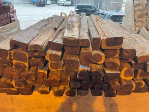 Hong Kong Customs on March 7 detected a suspected smuggling case involving a river trade vessel. A large batch of suspected smuggled goods with a total estimated market value of about $24 million was seized. Photo shows some of the suspected scheduled red sandalwood seized.