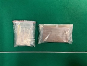 Hong Kong Customs today (March 15) seized about 1.2 kilograms of suspected cocaine and about 260 grams of suspected crack cocaine with a total estimated market value of about $1.4 million in Kwai Chung. Photo shows the suspected dangerous drugs seized.