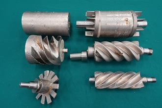 Hong Kong Customs on March 27 detected a suspected case of large-scale gold smuggling involving air freight, and seized about 146 kilograms of suspected gold with an estimated market value of about $84 million, at Hong Kong International Airport. Photo shows the suspected smuggled gold which was moulded and camouflaged as air compressor parts.