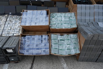 Hong Kong Customs on April 4 detected a suspected case of using an ocean-going vessel to smuggle goods to Malaysia at the Kwai Chung Container Terminals. A large batch of suspected smuggled goods, including integrated circuits, computer servers, routers, together with a batch of electronic waste, with a total estimated market value of about $100 million, was seized. Photo shows some of the suspected smuggled goods seized.