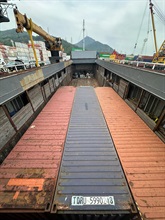 Hong Kong Customs yesterday (July 24) detected a large-scale illicit cigarette smuggling case in the waters off Lamma Island and seized about 30 million suspected illicit cigarettes, with an estimated market value of about $140 million and a duty potential of about $100 million, on board a cargo vessel. About 10 million suspected illicit cigarettes seized were duty-not-paid cigarettes known as "cheap whites", accounting for about 30 per cent of the total seizure. Photo shows three containers carrying suspected illicit cigarettes on board the cargo vessel.