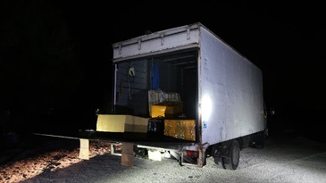 Hong Kong Customs detected a suspected speedboat-related smuggling case in Lau Fau Shan on March 16. A batch of suspected smuggled goods, including electronic products, high-value food and cosmetics, with an estimated market value of about $20 million was seized. Photo shows the lorry suspected to be involved in the case.