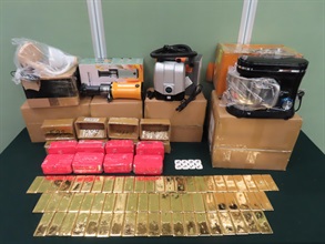 Hong Kong Customs on March 5 detected a suspected air freight gold bullion-smuggling case, and seized about 64 kilograms of suspected gold bullion with an estimated market value of about $46 million, at Hong Kong International Airport. Photo shows the batch of suspected gold bullion found by Customs officers inside some cardboard boxes which contained other goods.