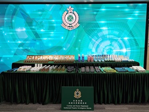 Hong Kong Customs on March 11 and 13 mounted special operations in Sheung Shui and Yuen Long to combat the sale of counterfeit goods activities. Photo shows the suspected counterfeit perfumes, cosmetic and skin care products seized.