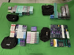 An incoming 49-year-old male passenger was sentenced to eight months' imprisonment at the West Kowloon Magistrates' Courts today (May 16) for importing duty-not-paid cigarettes and alternative smoking products, in contravention of the Dutiable Commodities Ordinance and the Import and Export Ordinance. Photo shows the duty-not-paid cigarettes and alternative smoking products seized.