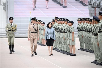The Convenor of the Non-official Members of the Executive Council, Mrs Regina Ip, inspects passing-out officers at the Hong Kong Customs Passing-out Parade today (June 5).