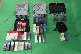An incoming 35-year-old female passenger was sentenced to six months' imprisonment and fined $2,000 at the West Kowloon Magistrates' Courts today (June 14) for possessing duty-not-paid cigarettes and failing to declare them to Customs officers, in contravention of the Dutiable Commodities Ordinance. Photo shows the duty-not-paid cigarettes seized.