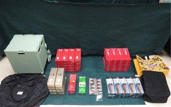 A 34-year-old incoming female passenger was sentenced to four months' imprisonment with a fine of $1,000 at the Fanling Magistrates' Courts today (June 16) for possessing duty-not-paid cigarettes and failing to declare them to Customs Officers at the Lo Wu Control Point yesterday (June 15), in contravention of the Dutiable Commodities Ordinance. Photo shows the duty-not-paid cigarettes seized.