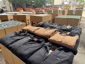 Hong Kong Customs conducted a four-week enforcement operation codenamed "Ocean Shield" from May 28 to June 27 to combat counterfeit and infringing goods activities involving cross-boundary transshipments by sea cargo and local deliveries. During the operation, Customs detected 36 related cases and seized about 157 000 items of suspected counterfeit goods with an estimated market value of over $72 million. Photo shows some of the suspected counterfeit clothing seized.