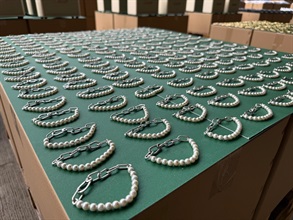 Hong Kong Customs conducted a four-week enforcement operation codenamed "Ocean Shield" from May 28 to June 27 to combat counterfeit and infringing goods activities involving cross-boundary transshipments by sea cargo and local deliveries. During the operation, Customs detected 36 related cases and seized about 157 000 items of suspected counterfeit goods with an estimated market value of over $72 million. Photo shows some of the suspected counterfeit accessories seized.