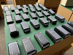 Hong Kong Customs conducted a four-week enforcement operation codenamed "Ocean Shield" from May 28 to June 27 to combat counterfeit and infringing goods activities involving cross-boundary transshipments by sea cargo and local deliveries. During the operation, Customs detected 36 related cases and seized about 157 000 items of suspected counterfeit goods with an estimated market value of over $72 million. Photo shows some of the suspected counterfeit mobile phones seized.