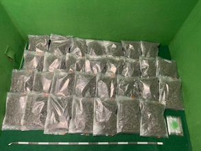Hong Kong Customs yesterday (July 6) and today (July 7) detected two dangerous drug trafficking cases involving baggage concealment at Hong Kong International Airport. About 15 kilograms of suspected cannabis buds and 2kg of suspected heroin with a total estimated market value of about $4.2 million were seized. Photo shows the suspected cannabis buds seized.