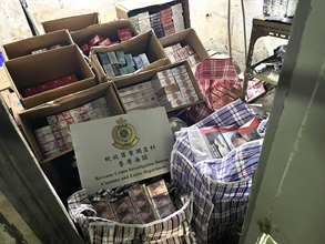 Hong Kong Customs shut down two suspected illicit cigarette storage centres in Sham Shui Po today (July 16), seizing a total of about 1 million suspected illicit cigarettes with an estimated market value of about $4.5 million and a duty potential of about $3.3 million. One 45-year old non-local man was arrested. Photo shows a suspected illicit cigarette storage centre and some of the suspected illicit cigarettes seized.