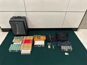An incoming 60-year-old female passenger was sentenced to 30 days' imprisonment and fined $2,000 at the Fanling Magistrates' Courts today (July 18) for possessing 5 611 duty-not-paid cigarettes and failing to declare them to Customs officers at the Lok Ma Chau Spur Line Control Point, in contravention of the Dutiable Commodities Ordinance. Photo shows the duty-not-paid cigarettes seized.